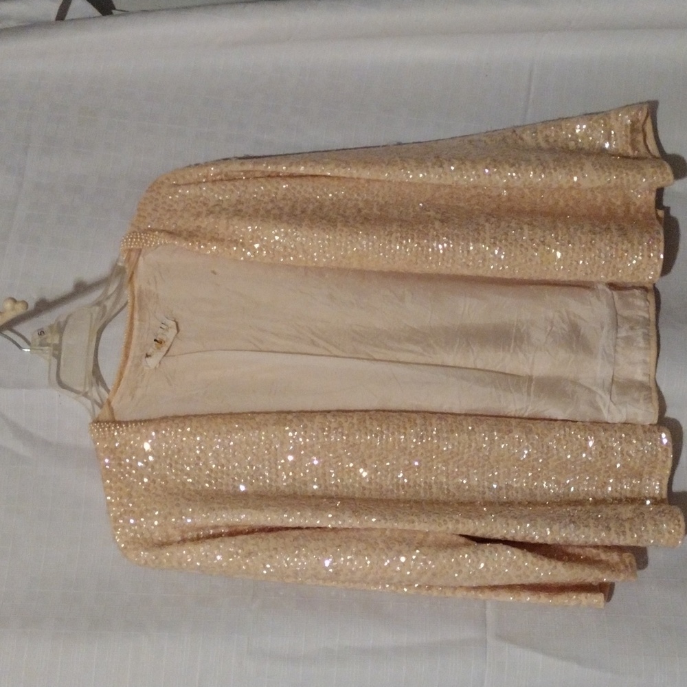 Elegant cream color sequin cocktail jacket with pearl trim. CYNLES